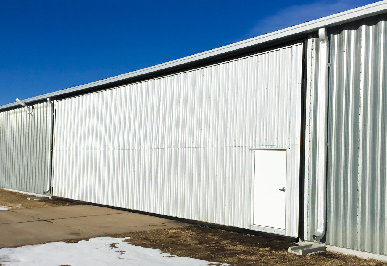 White bi-fold hangar door