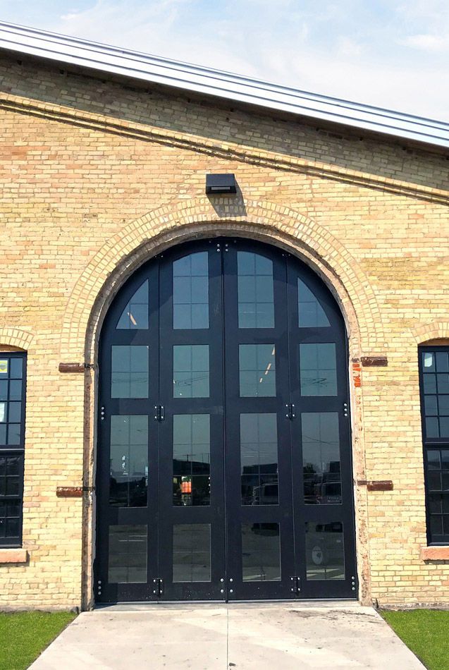 Each of the custom doors at the brewery measures 12 feet wide by 16 feet tall and weighs 2,300 pounds.