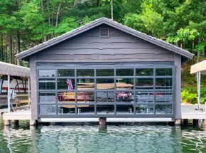 Architectural hydraulic boathouse door